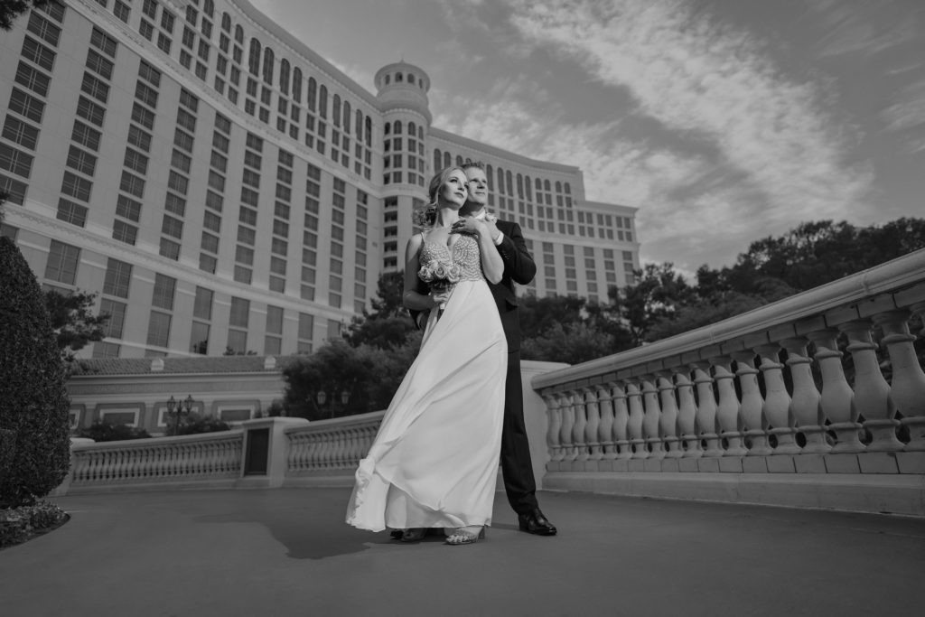 Bride and groom portrait at Bellagio Las Vegas with elegant architecture black and white