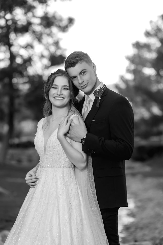 Bride and groom portrait outdoors in black and white