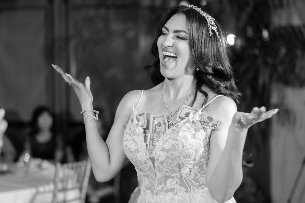 black and white wedding money dance moment bride celebrating photographed by Zoltan Redl Nagy