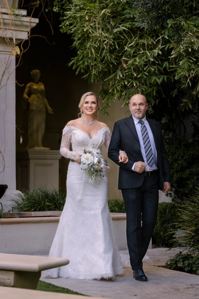 bride walking with father at Caesars Palace Las Vegas wedding ceremony photographed by Zoltan Redl Nagy