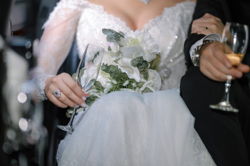 wedding detail bouquet and champagne glasses close up bride and groom hands Caesars Palace Las Vegas photographed by Zoltan Redl Nagy