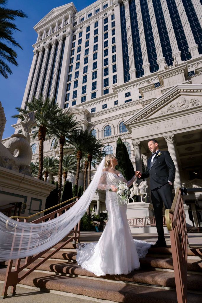 bride and groom portrait on grand staircase Caesars Palace Las Vegas wedding photographed by Zoltan Redl Nagy