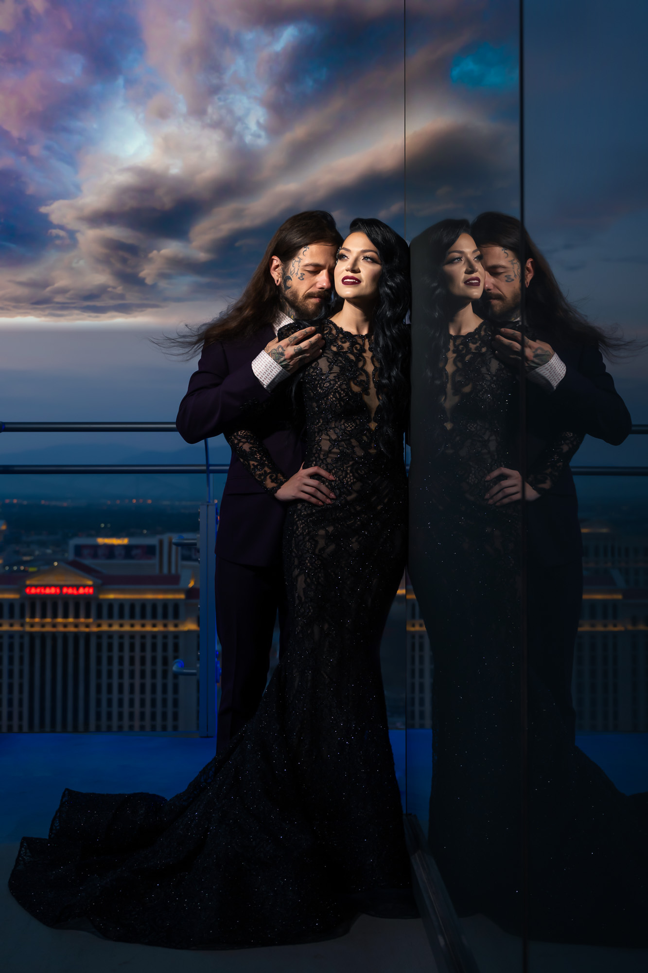 Dramatic blue hour wedding portrait of bride and groom on balcony at The Cosmopolitan Las Vegas