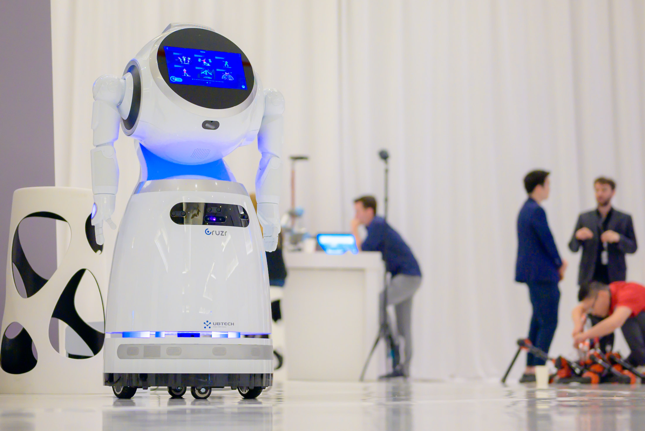 Las Vegas event photography capturing technology conference with robot showcase and attendees networking, photographed by Zoltan Redl-Nagy