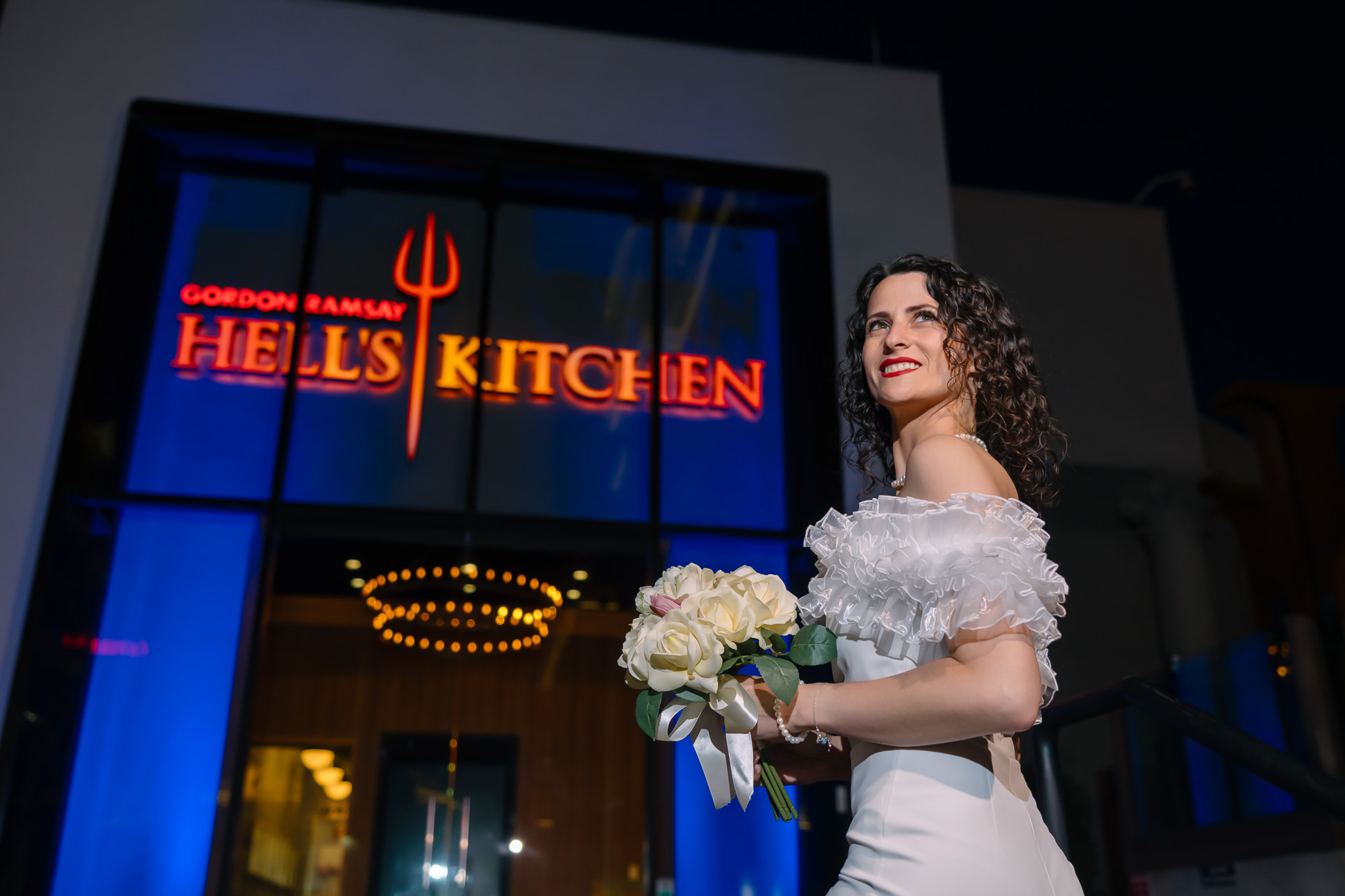 Las Vegas Strip elopement bride portrait at Hell’s Kitchen restaurant photographed by Zoltan Redl Nagy