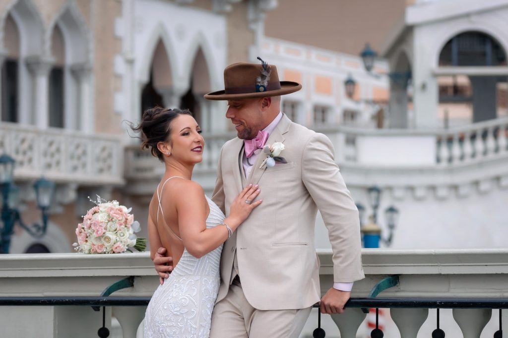 Romantic wedding portrait of bride and groom at The Venetian bridge in Las Vegas