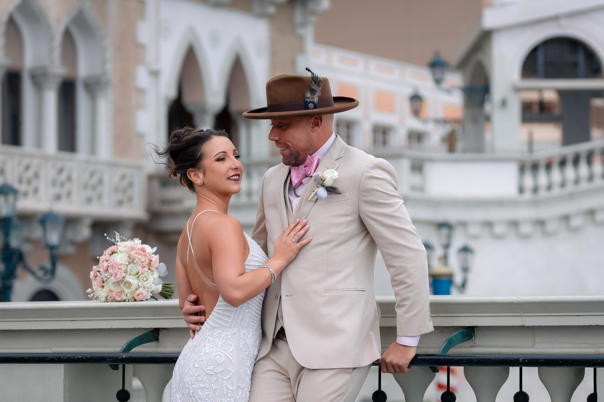 Romantic wedding portrait of bride and groom at The Venetian bridge in Las Vegas