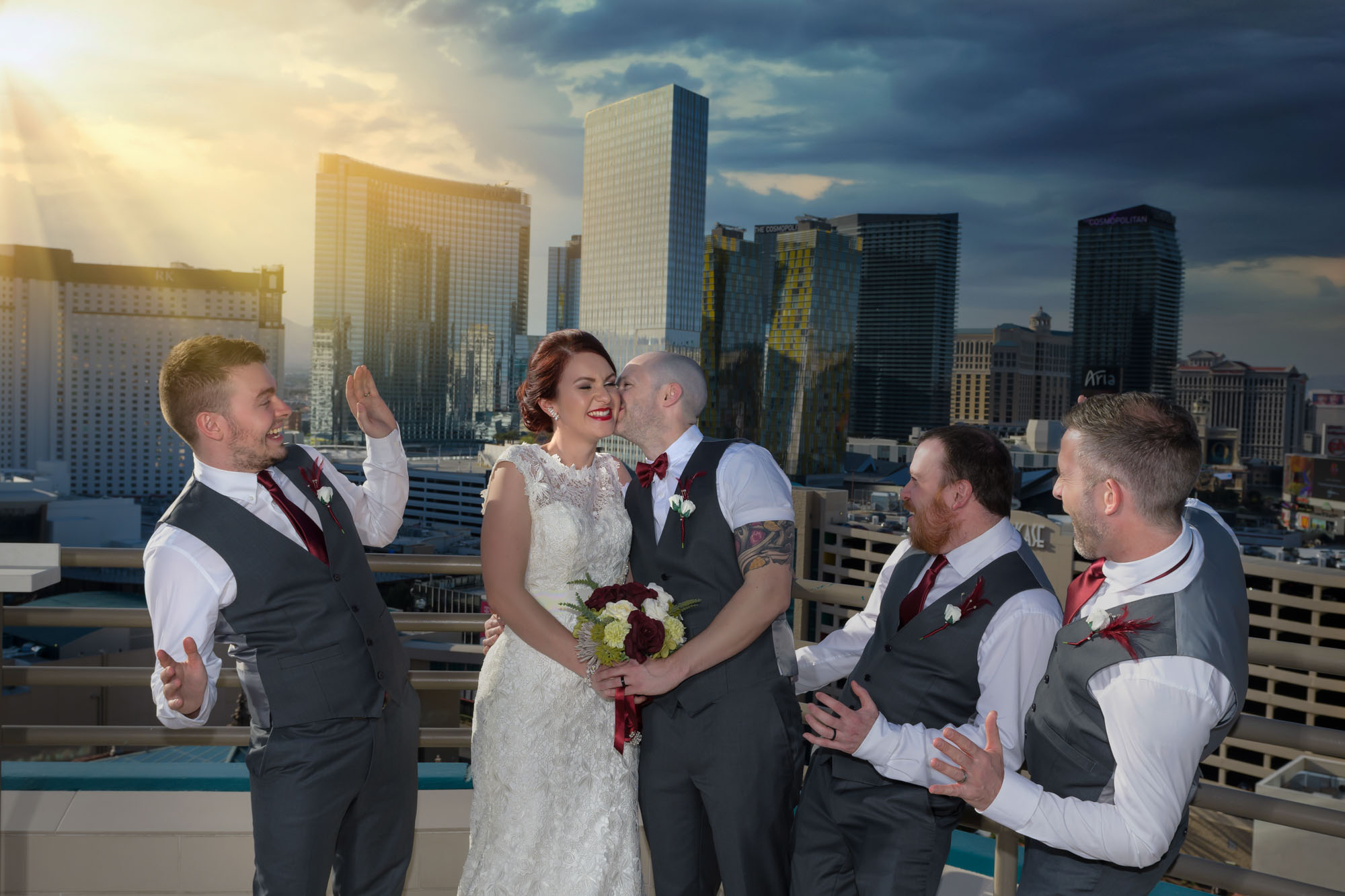 Las Vegas Strip elopement couple with friends on MGM Grand balcony skyline photographed by Zoltan Redl Nagy