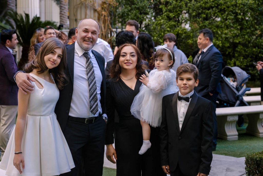Las Vegas wedding family portrait candid moment at Caesars Palace Venus Garden photographed by Zoltan Redl Nagy