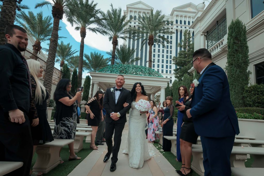 Wedding couple walking down the aisle during a ceremony at Caesars Palace Las Vegas