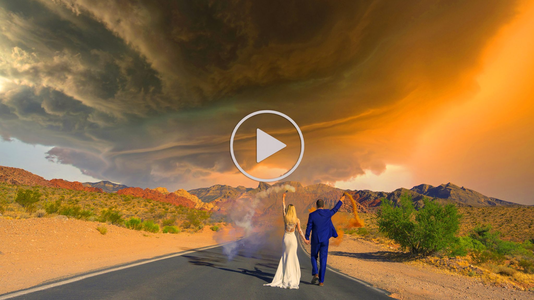 Las Vegas wedding couple walking in desert with smoke bombs cinematic slideshow play button image photographed by Zoltan Redl Nagy