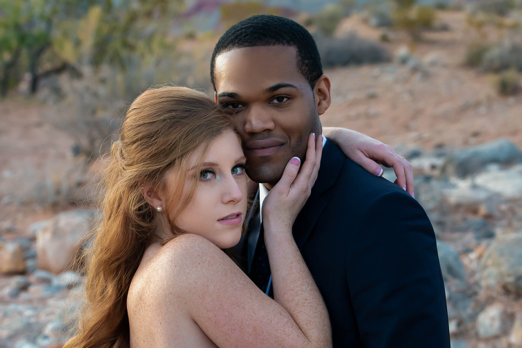 Red Rock Canyon elopement couple close-up romantic embrace portrait