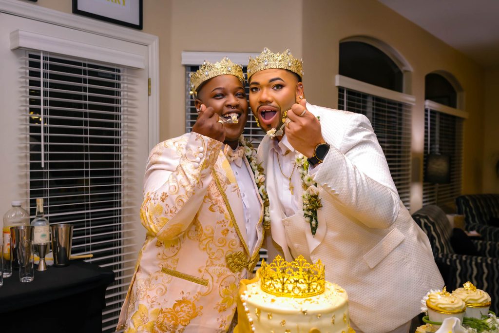 Same sex wedding couple feeding each other cake during celebration in Las Vegas, photographed by Zoltan Redl Nagy.