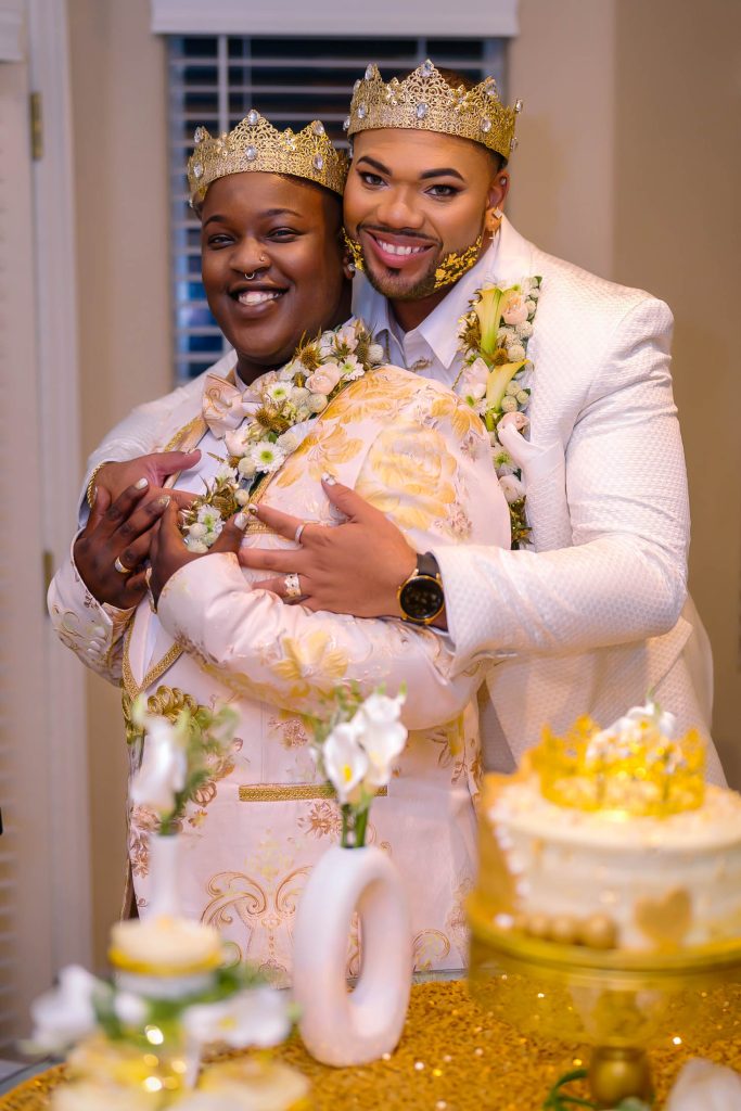 Same sex wedding couple embracing during cake cutting moment in Las Vegas, photographed by Zoltan Redl Nagy.