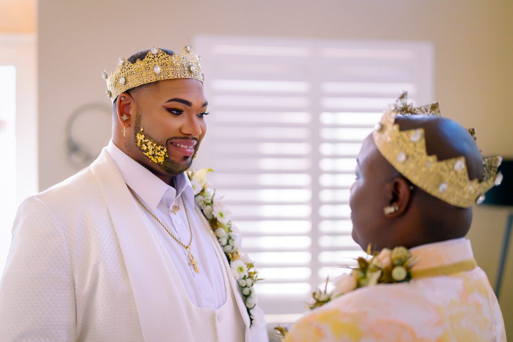 Same sex wedding grooms first look moment indoors in Las Vegas, photographed by Zoltan Redl Nagy.