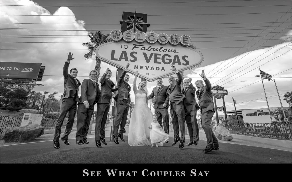 Las Vegas wedding couple and group at Welcome to Fabulous Las Vegas sign black and white photographed by Zoltan Redl Nagy