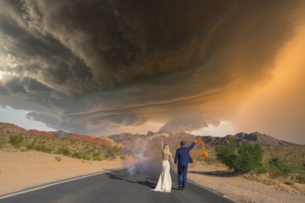 Elopement couple walking on desert road in Red Rock Canyon near Las Vegas