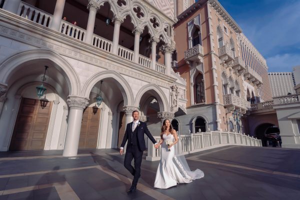 Las Vegas Strip elopement couple walking at The Venetian Resort photographed by Zoltan Redl Nagy