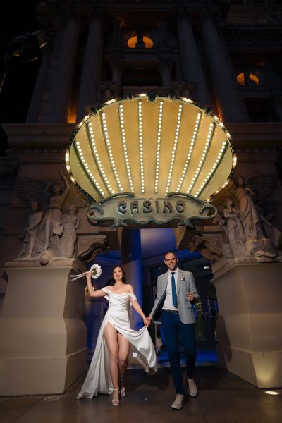 Las Vegas Strip elopement couple exiting Paris Las Vegas casino at night photographed by Zoltan Redl Nagy