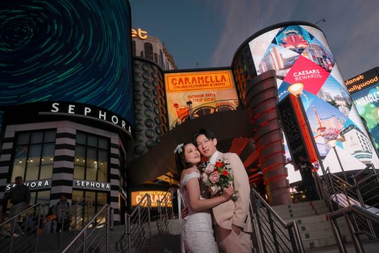 Las Vegas Strip elopement couple portrait at Planet Hollywood under neon lights photographed by Zoltan Redl Nagy
