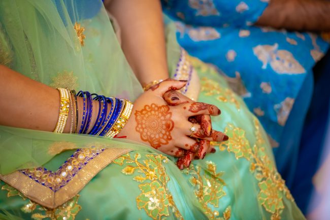 indian wedding mehndi hands detail traditional henna jewelry photo by zoltan redl-nagy