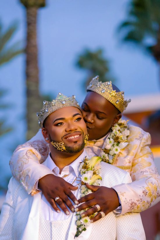 Same sex wedding grooms portrait with kiss and embrace at Red Rock Casino Las Vegas, photographed by Zoltan Redl Nagy.
