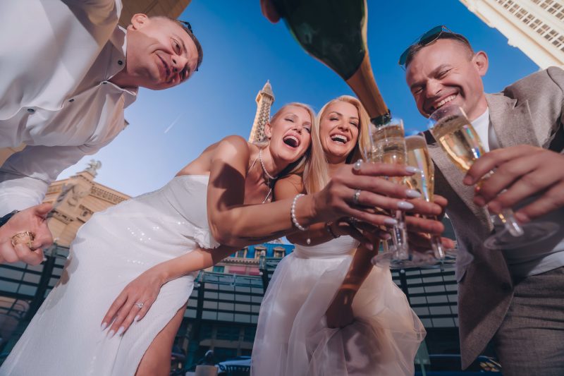 Las Vegas Paris Hotel Eiffel Tower elopement champagne celebration couple