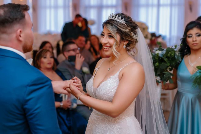 Bride and groom exchanging rings during Las Vegas wedding ceremony indoor