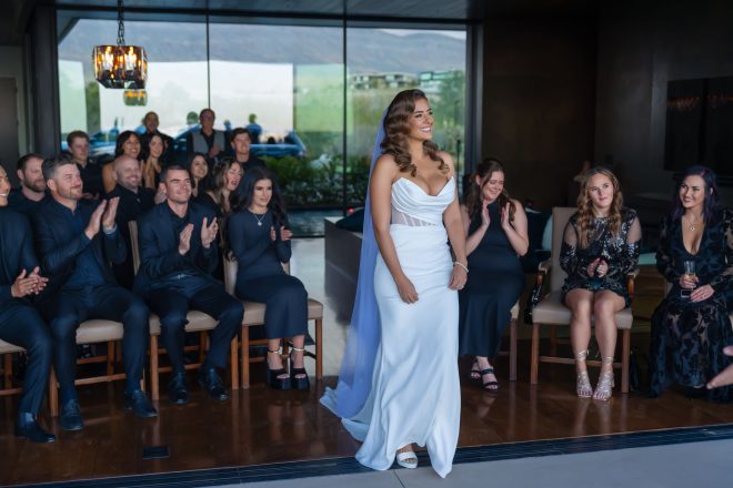 Bride walking down the aisle during Las Vegas wedding ceremony modern venue