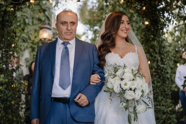 Father walking the bride down the aisle at an Armenian wedding ceremony at Lakeside Weddings & Events in Las Vegaswedding ceremony at The Grove Las Vegas