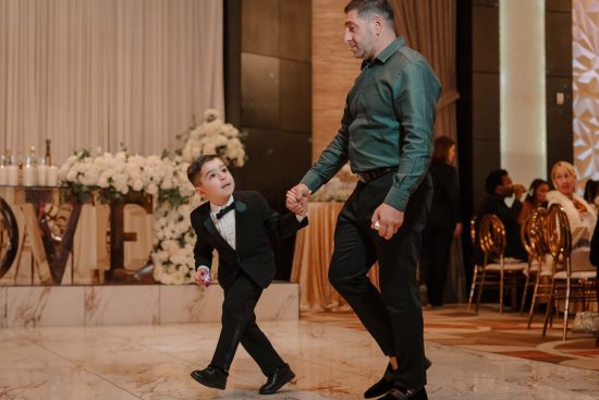 Young ring bearer arriving at the Armenian wedding reception at Fabrizio Banquet Hall in Las Vegas