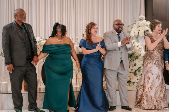 Family welcoming the bride and groom into their Armenian wedding reception at Fabrizio Banquet Hall