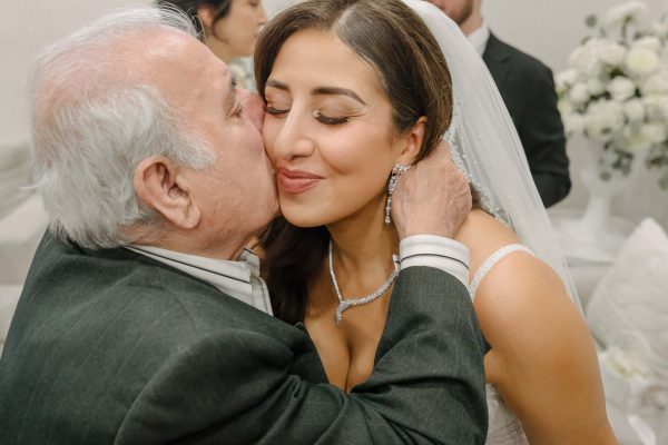 Bride sharing an emotional moment with her grandfather before an Armenian wedding in Las Vegas
