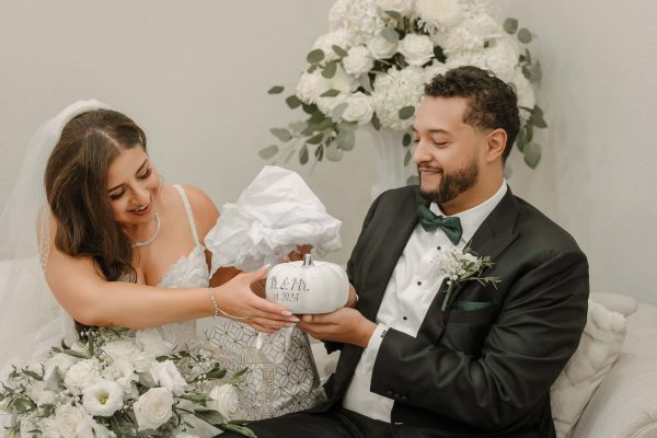 Bride and groom exchanging traditional Armenian wedding gifts before the ceremony in Las Vegas