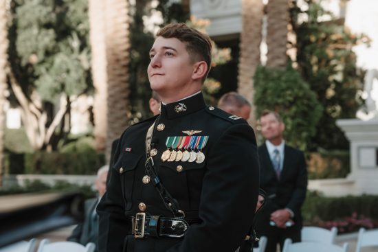 Groom waiting for his bride during an outdoor Caesars Palace wedding ceremony in Las Vegas.