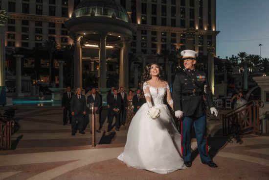 Bride preparing to toss her bouquet during a Caesars Palace wedding reception in Las Vegas.