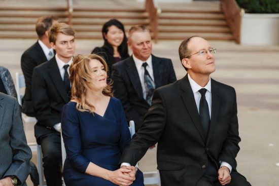 The groom's parents watching the outdoor wedding ceremony at Caesars Palace in Las Vegas.