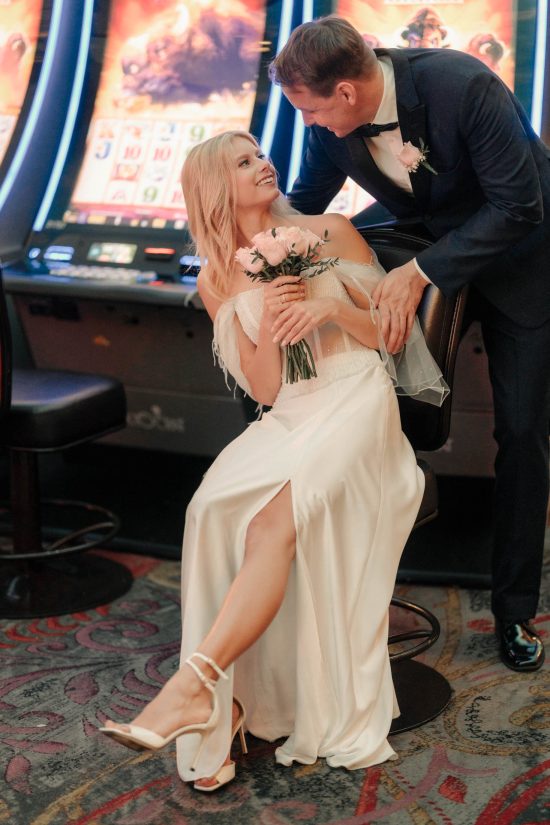 Bride and groom sharing a romantic moment inside Paris Las Vegas during their intimate elopement.