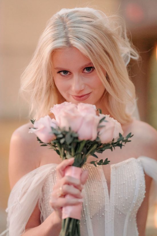 Elegant bridal portrait with a bouquet inside Paris Las Vegas during a romantic elopement.