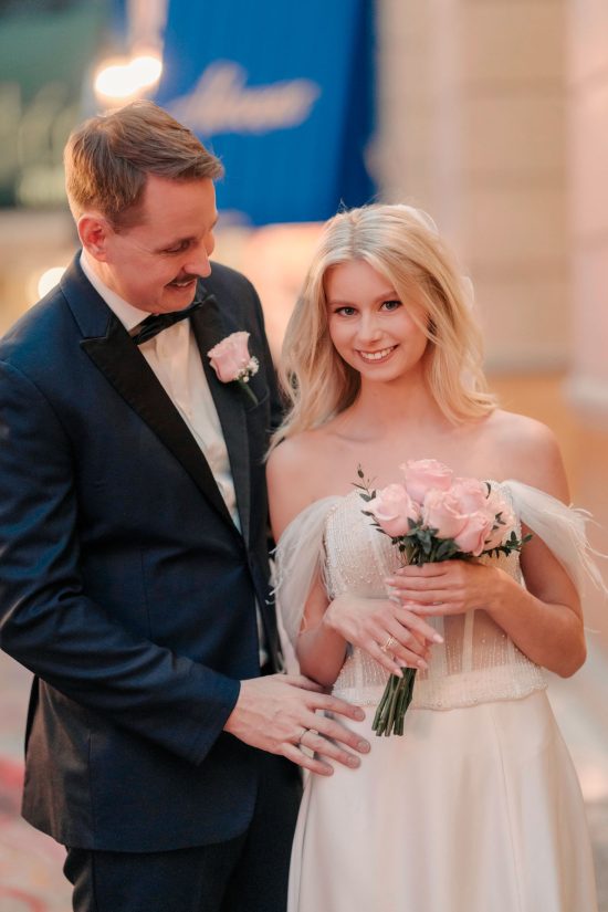 Bride and groom sharing a romantic portrait inside Paris Las Vegas after their intimate elopement ceremony.