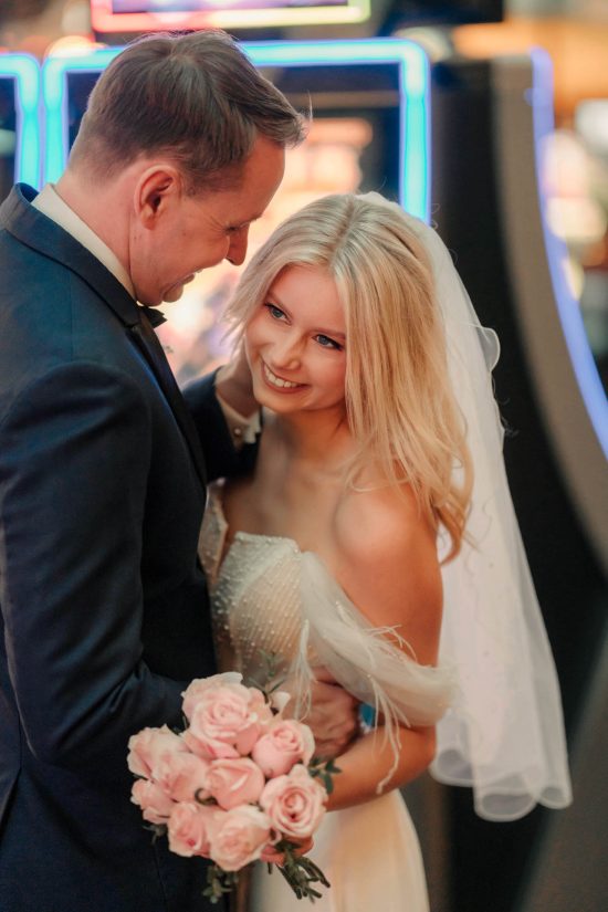 Bride and groom sharing a romantic moment inside Paris Las Vegas during their luxury elopement