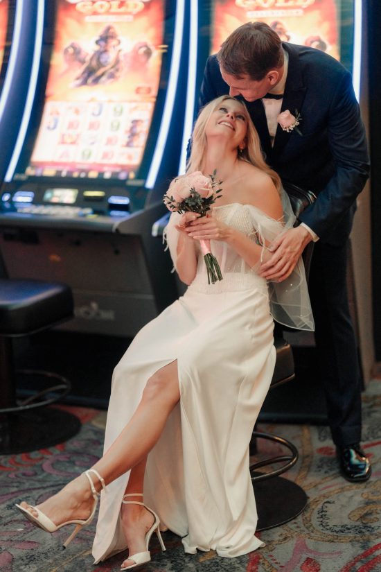 Romantic Las Vegas Paris Hotel elopement couple sharing an intimate moment inside the casino