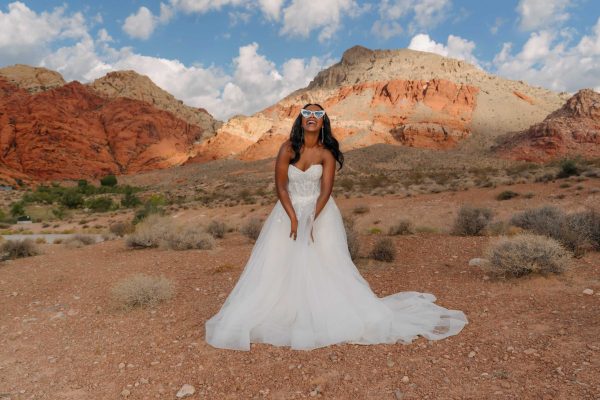 Bride smiling during a sunrise bridal portrait session at Calico Basin in Red Rock Canyon near Las Vegas